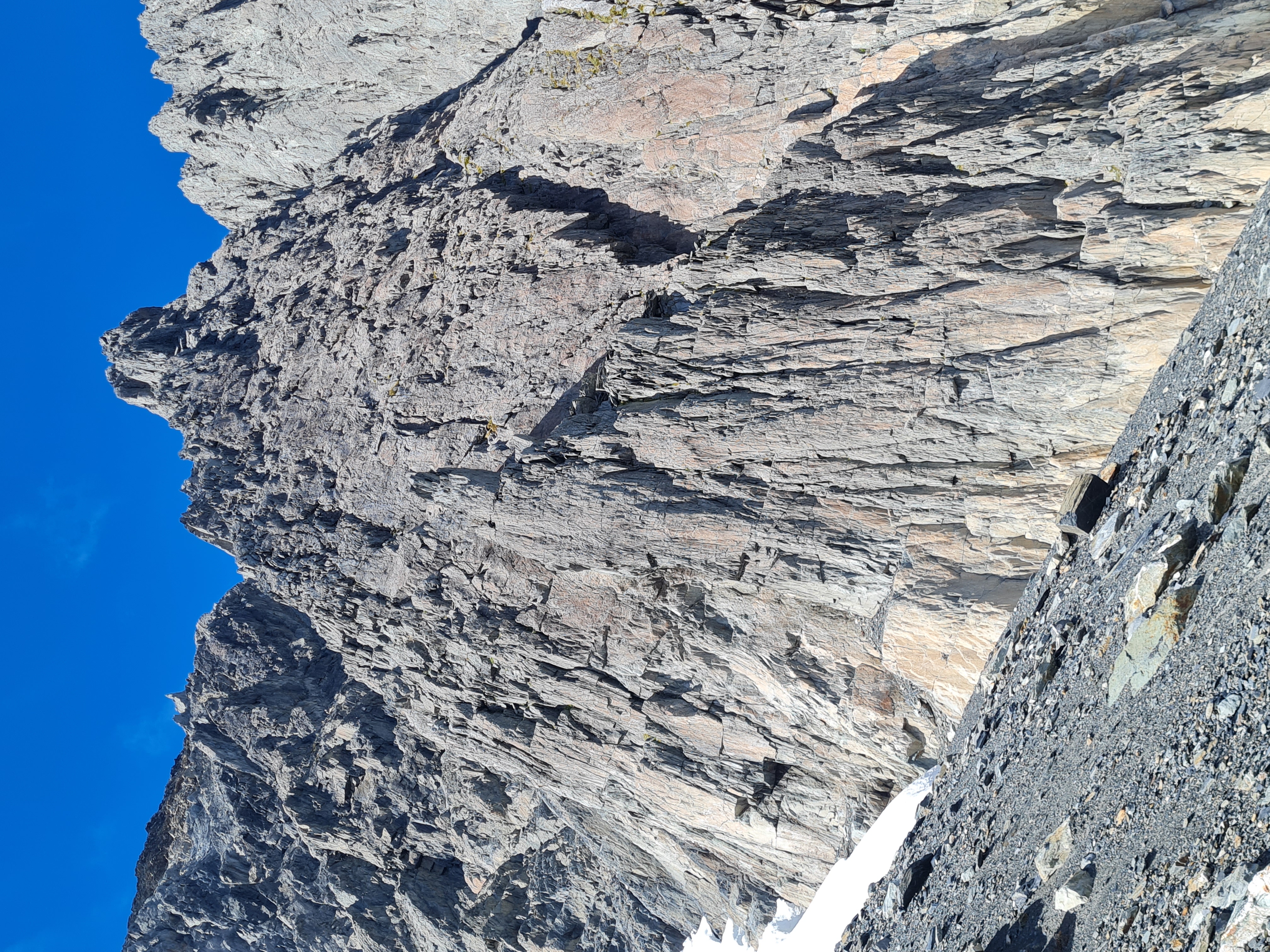 The central rib. A variety of starts (in the vicinity if the visible snow) gain the rib that angles up from the left. First tower visible as the knob on the skyline.