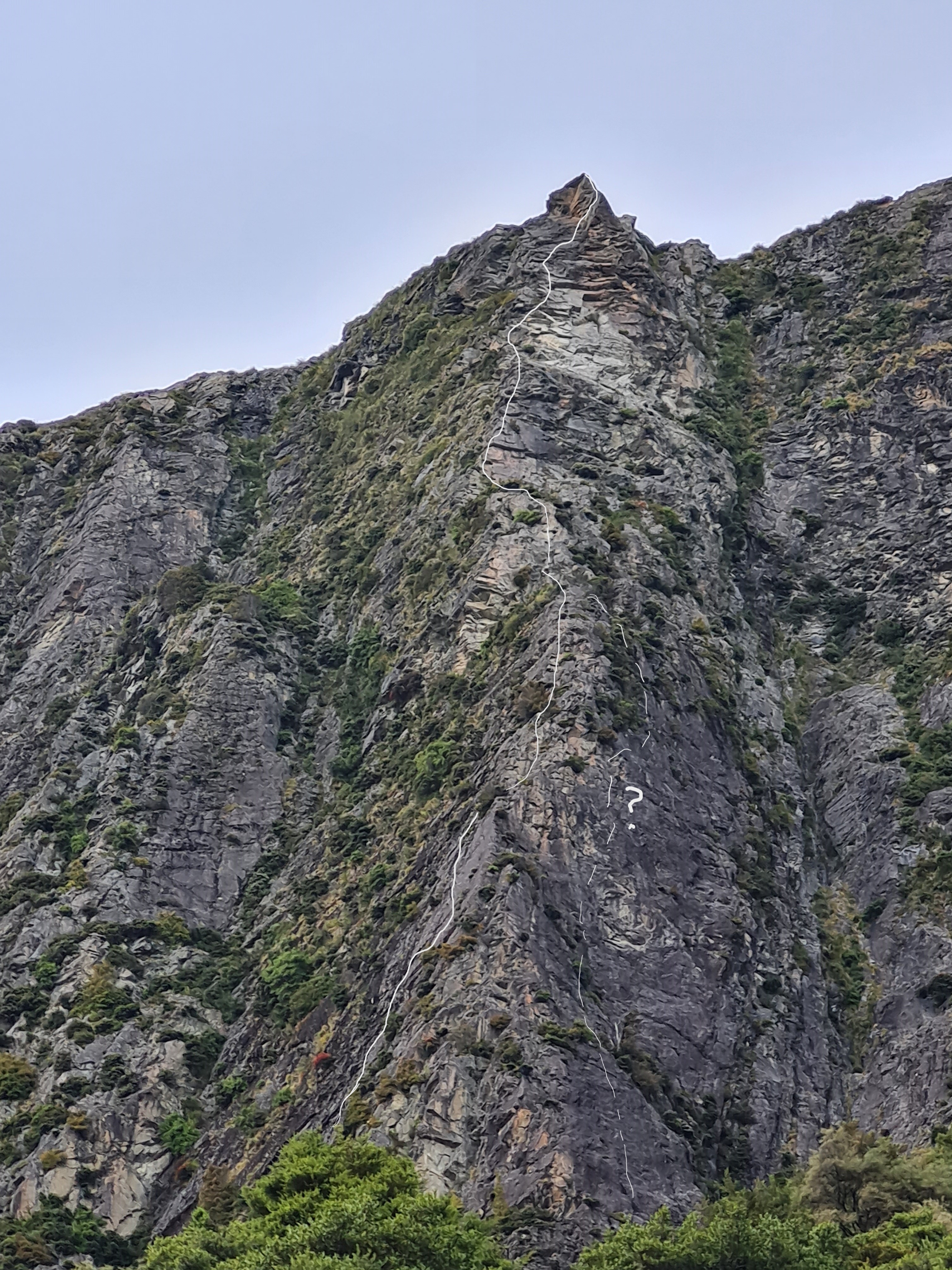 A long arete. Dashed line with (?) on right indicates  an excellent-looking alternative; a 4-5 pitch 19 (Brent Shears, early 2000s?)