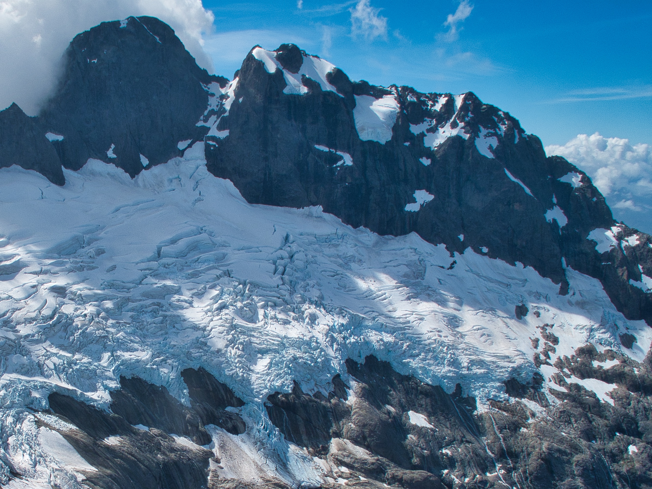 Ngaitahu Pk (centre) and Te Wera (left) above the Te Puoho Glacier. Photo: Richard Thomson