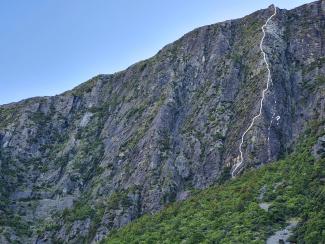 A long arete. The dashed line on right side indicates an excellent-looking  alternative; a 4-5 pitch 19 (Brent Shears, early 2000s?)