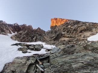 Near top of the scrambling / soloing, heading left to base of a rock corner. various other options (easier)